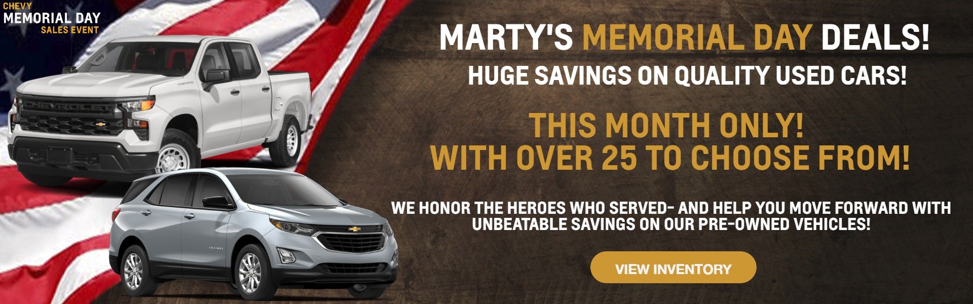 White Silverado and grey Equinox on flag and wood background