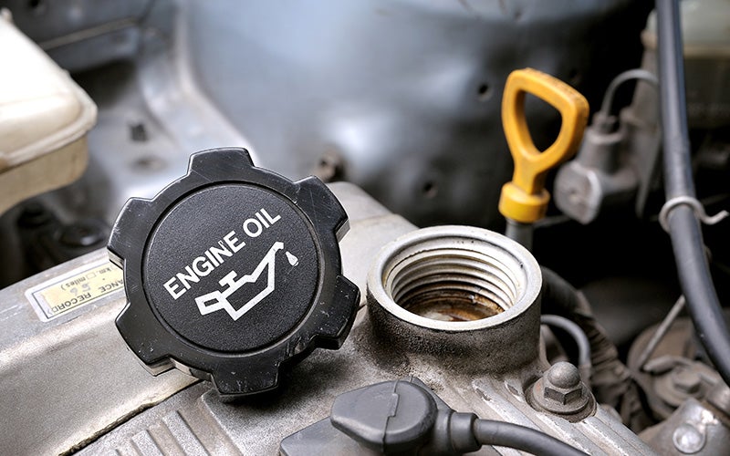 Technician performing an oil change